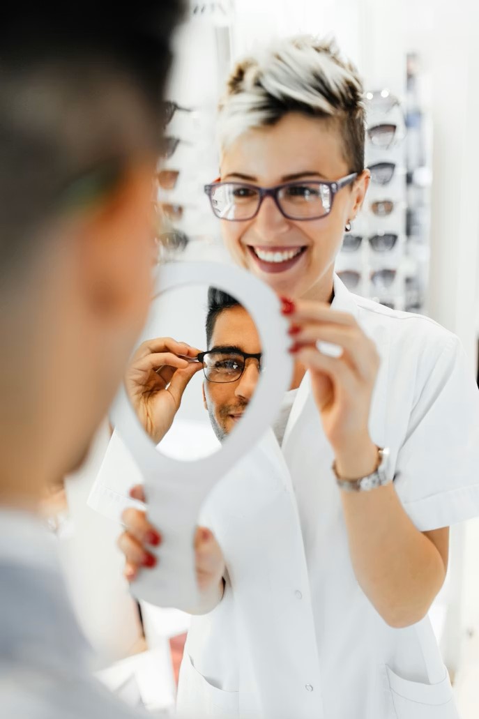 Man trying fashionable eyeglass frames