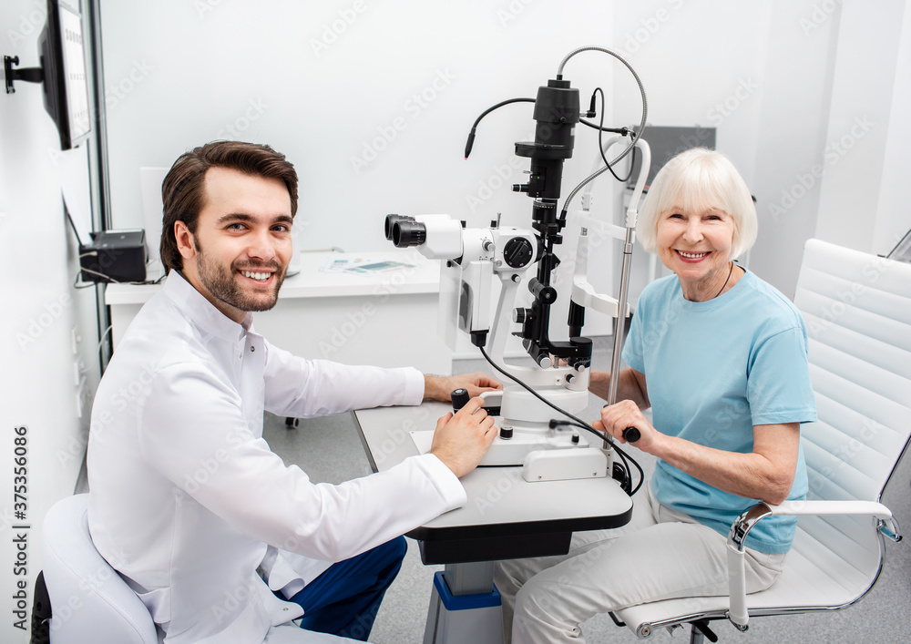 Eye doctor examining an older patient's eyes
