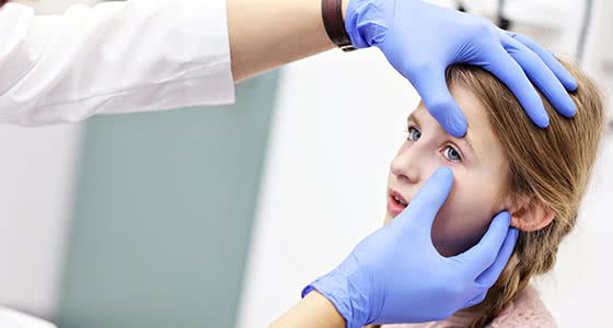Woman at an eye exam machine